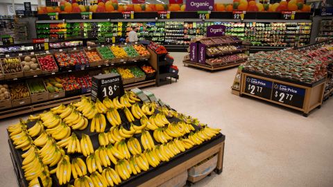 Walmart is adding new signs, wider aisles and lowering bin heights to create an "open market feel."