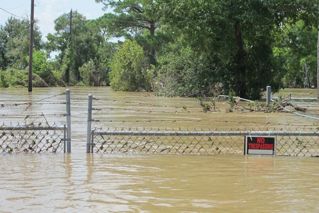 A barbed wire fence in Highlands, Texas, surrounds a toxic waste site that was flooded by water from the nearby San Jacinto River as a result of Hurricane Harvey. 