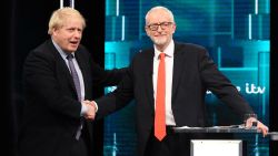 SALFORD, ENGLAND - NOVEMBER 19: (AVAILABLE FOR EDITORIAL USE UNTIL DECEMBER 19, 2019) In this handout image supplied by ITV, Prime Minister Boris Johnson and Leader of the Labour Party Jeremy Corbyn shake hands during the ITV Leaders Debate at Media Centre on November 19, 2019 in Salford, England. This evening ITV hosted the first televised head-to-head Leader's debate of this election campaign. Leader of the Labour party, Jeremy Corbyn faced Conservative party leader, Boris Johnson after the SNP and Liberal Democrats lost a court battle to be included. (Photo by Jonathan Hordle//ITV via Getty Images)