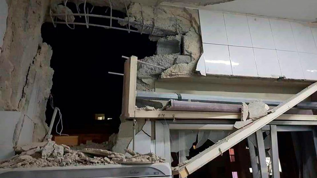 In this photo released by the Syrian official news agency SANA, a damaged building targeted by Israeli missile strikes is seen in Qudsaya suburb, west of the capital Damascus, Syria, on Wednesday.