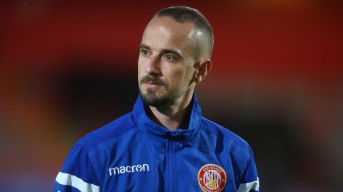 Stevenage caretaker boss Mark Sampson has been charged with using racist language.