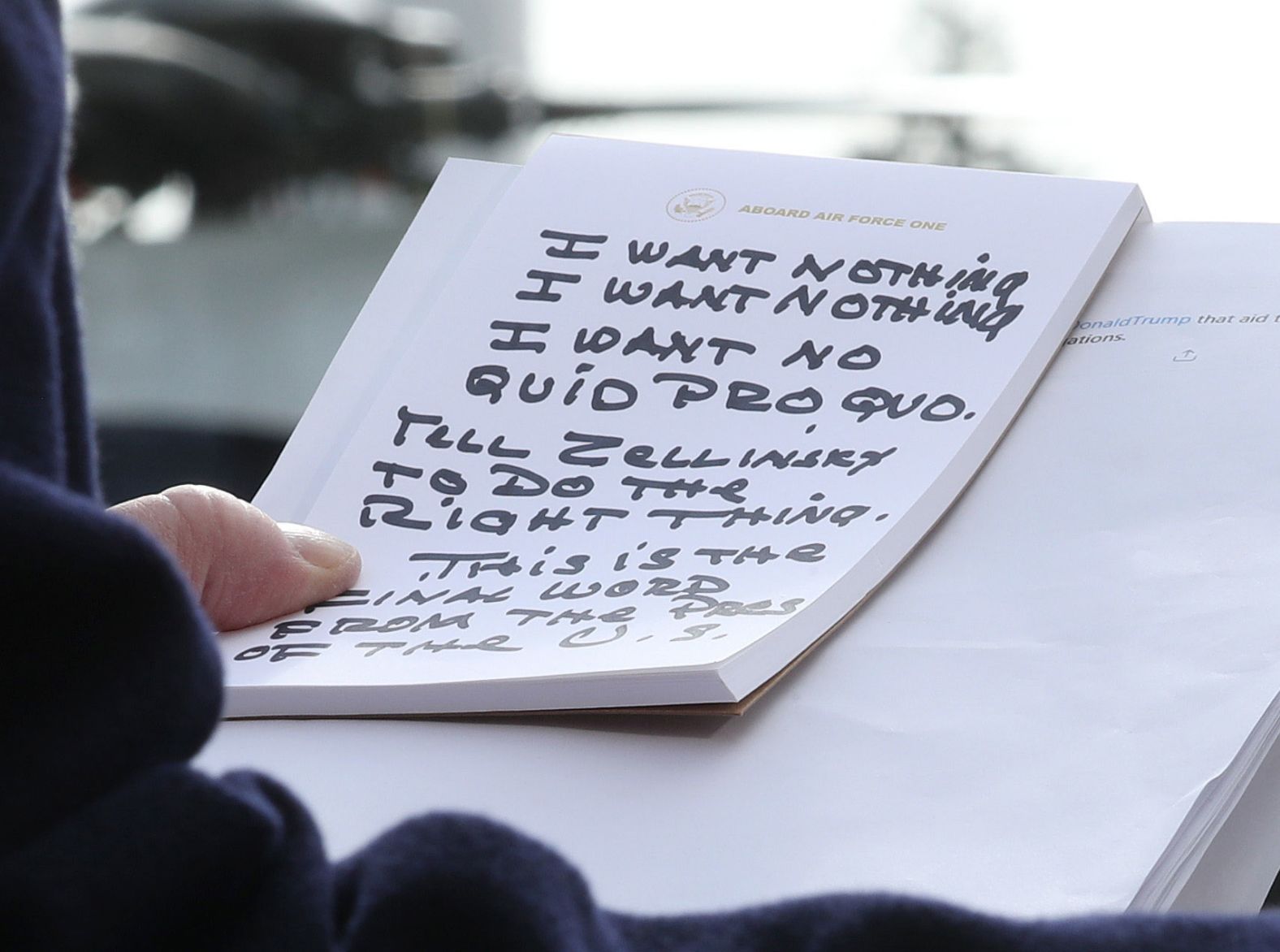 President Trump holds his notes while speaking to the media on November 20. Trump repeatedly said he told Sondland over the phone that he wanted "nothing" on Ukraine. "I say to the Ambassador in response: I want nothing, I want nothing. I want no quid pro quo," Trump said, reading from notes that appeared to be written in Sharpie. "Tell Zelensky, President Zelensky, to do the right thing."