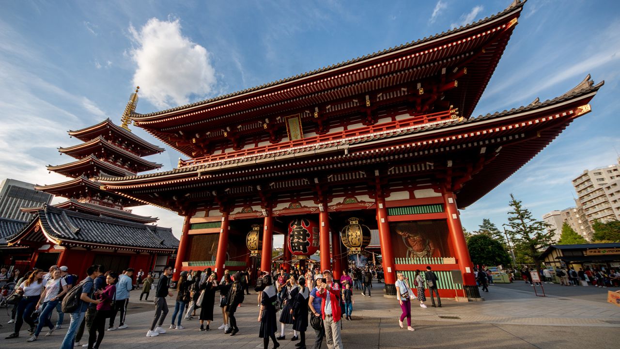 The bright red Senso-ji temple is punctuated by the adjacent five-story pagoda.