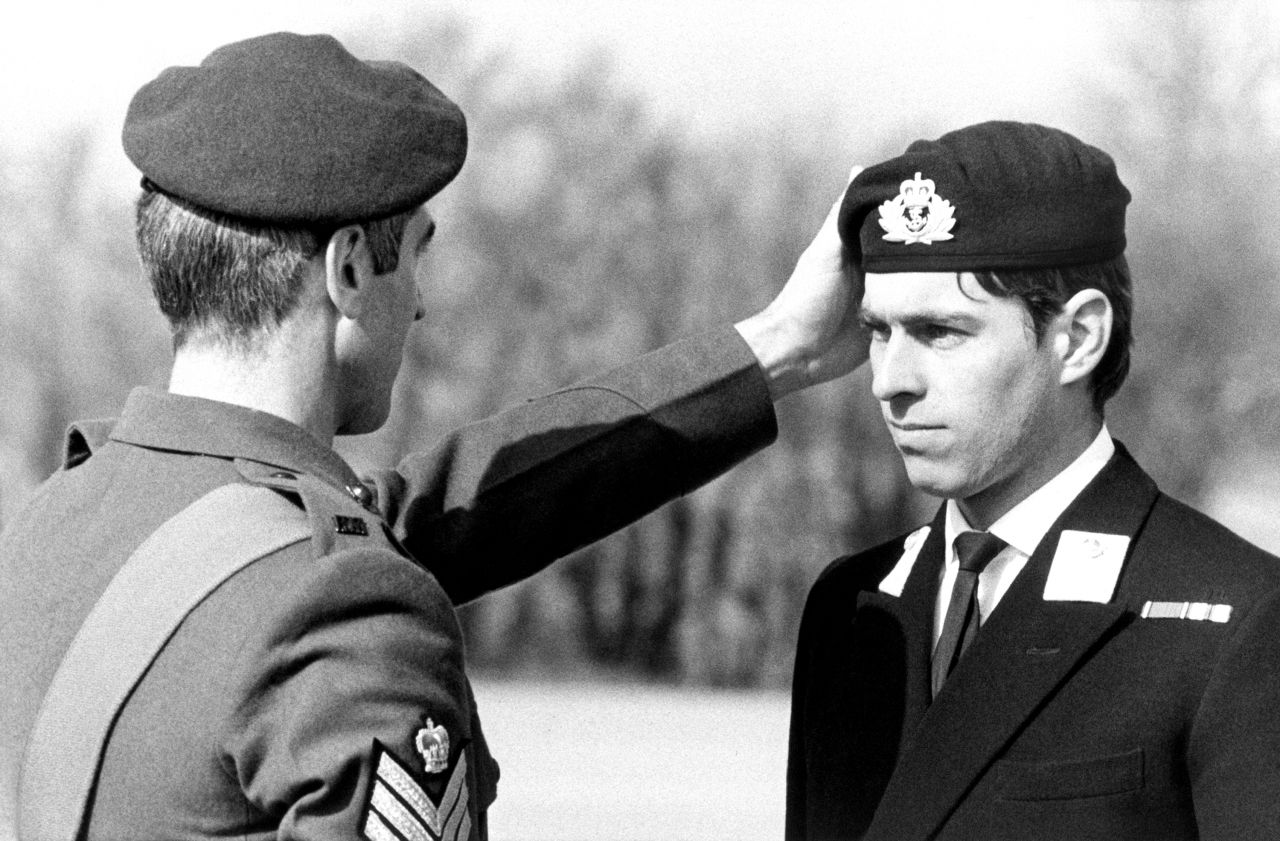 Prince Andrew receives a Green Beret award at an event in 1980. He served in the British Royal Navy for 22 years and was a helicopter pilot during the Falklands War.