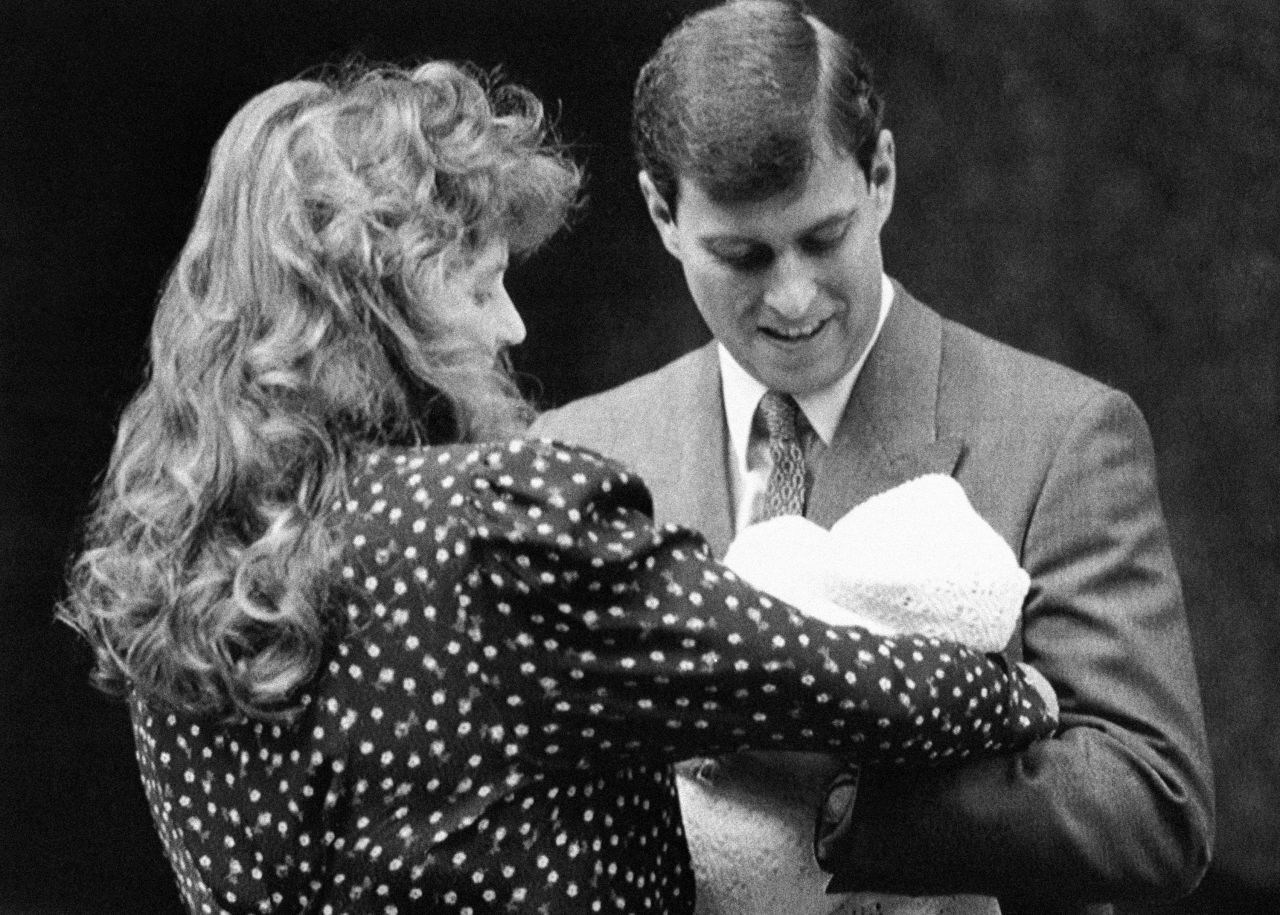 The couple holds their first child, Beatrice, in 1988. They had two children together before their high-profile divorce in 1996.