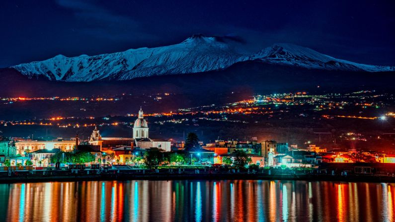 <strong>Catania, Italy: </strong>The snow-capped peak of active volcano Mount Etna is seen from the port of Riposto in Catania, Sicily. <br />