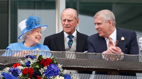 Prince Andrew and his parents watch horse racing in Epsom, England, in 2016.