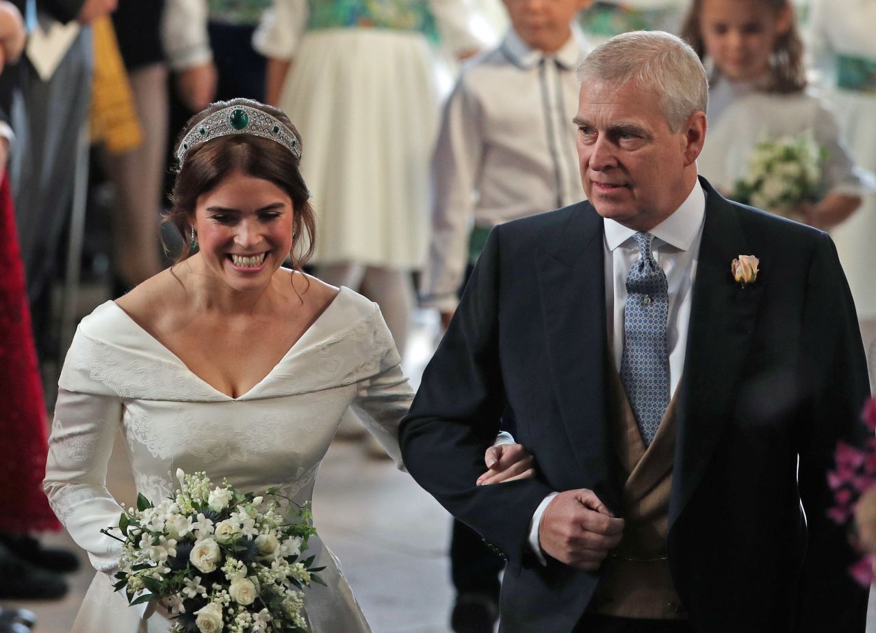 Princess Eugenie is accompanied by her father during her wedding in 2018.
