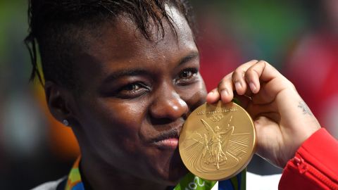 Nicola Adams poses on the podium with a gold medal during the Rio 2016 Olympic Games.