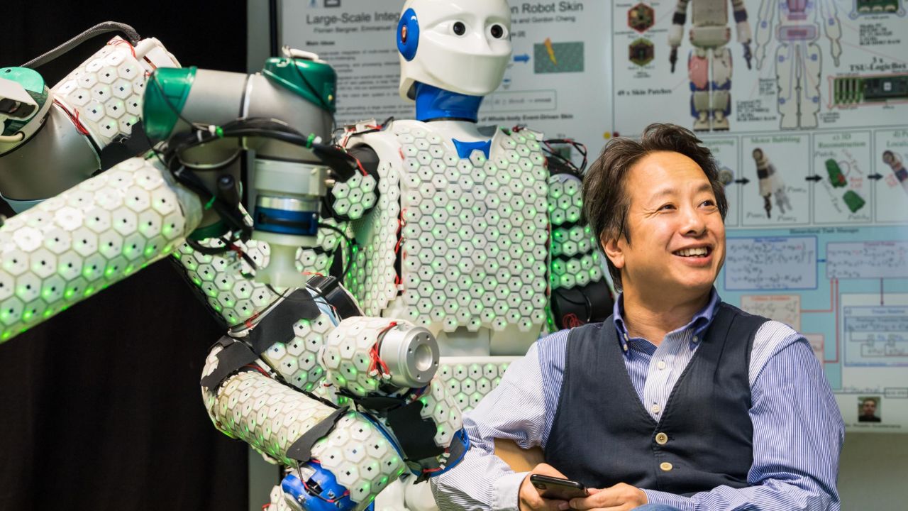 Professor Gordon Cheng with the H-1 robot, covered in 13,000 sensors that enable tactile sensation