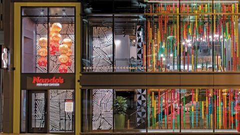 The lights in a Nando's restaurant in Birmingham, UK, were designed by Ashanti Design and are made from woven recycled fabric.