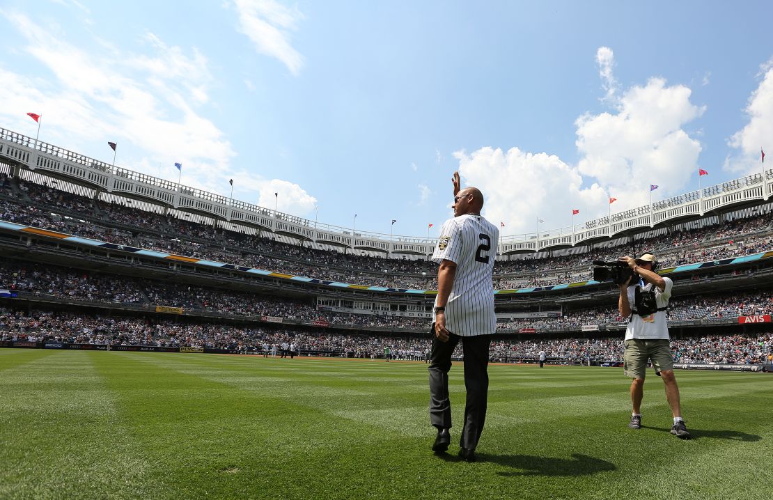 Jeter waves as he is introduced during a ceremony honoring the '96 Yankee championship.