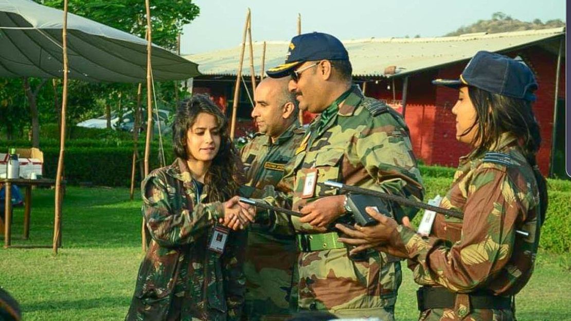 Police say they recovered photos of Mahbubani, seen in the center here wearing a cap, dressed in an army uniform.