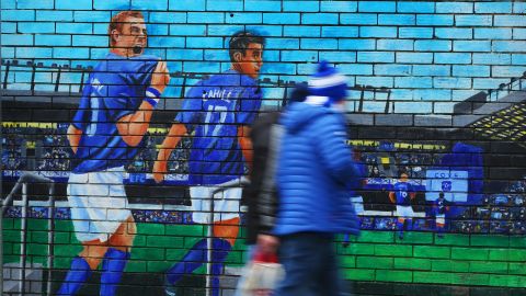 Fans walk past an Everton mural prior to the Premier League match between Everton FC and AFC Bournemouth at Goodison Park on January 13, 2019.