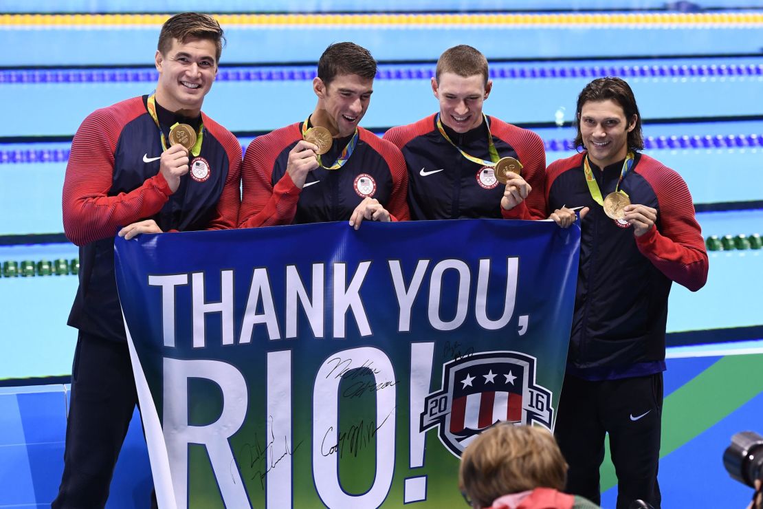USA's gold medalist team of Adrian (left), Michael Phelps, Ryan Murphy and Cody Miller (right)  during the podium ceremony of the men's swimming 4 x 100m medley relay final at the Rio 2016 Olympic Games.