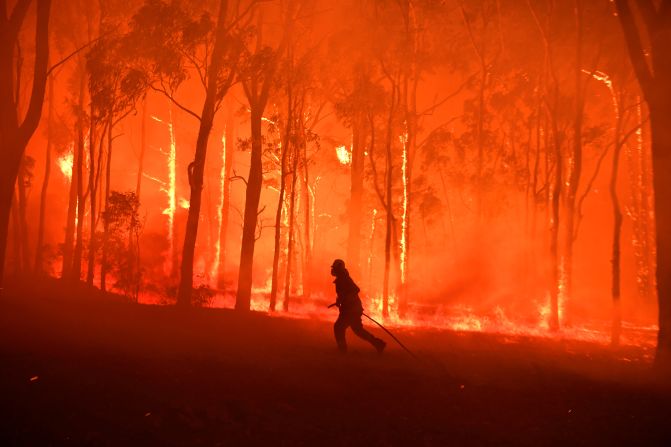 A firefighter in Australia tries to protect the Colo Heights Public School from being impacted by the Gospers Mountain fire on Tuesday, November 19. <a href="http://www.cnn.com/2019/11/08/world/gallery/australia-bushfires/index.html" target="_blank">Deadly bushfires</a> have ravaged parts of Australia in recent weeks, <a href="https://www.cnn.com/2019/11/20/australia/south-australia-fires-record-temperatures-intl-hnk/index.html" target="_blank">whipped up by soaring temperatures, strong winds and the worst drought in decades.</a>