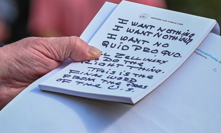 US President Donald Trump holds his notes while speaking to the media outside the White House on Wednesday, November 20. Trump repeatedly said he told US Ambassador Gordon Sondland over the phone that he wanted "nothing" on Ukraine. "I say to the Ambassador in response: I want nothing, I want nothing. I want no quid pro quo," Trump said, <a href="https://www.cnn.com/2019/11/20/politics/public-impeachment-hearing-day-4/index.html" target="_blank">reading from notes</a> that appeared to be written in Sharpie.