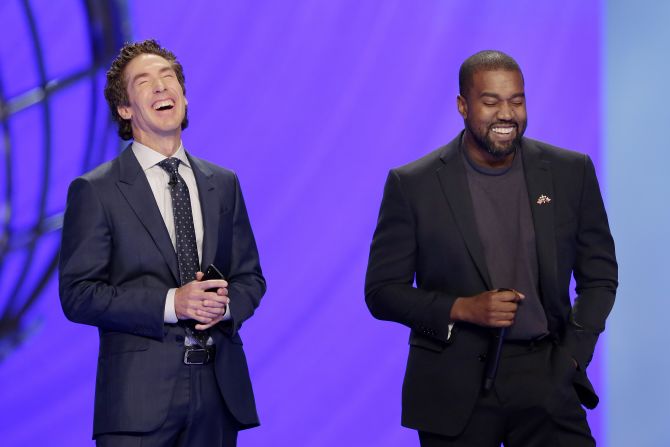Pastor Joel Osteen, left, laughs with rapper Kanye West as West leads a prayer at Osteen's Lakewood Church in Houston on Sunday, November 17. <a href="https://www.cnn.com/2019/11/16/us/kanye-west-lakewood-church-ticket-scalping-trnd/index.html" target="_blank">West performed several of his songs during the service.</a>
