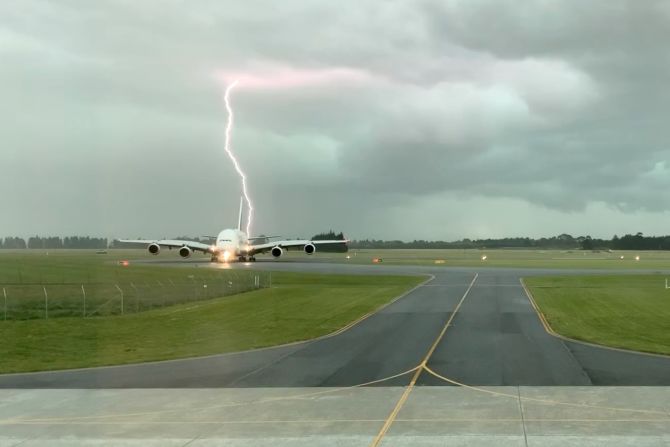 Lightning strikes close to a passenger plane in Christchurch, New Zealand, on Wednesday, November 20.