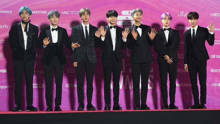 In this picture taken on January 15, 2019, South Korean boy band BTS, also known as the Bangtan Boys, pose on the red carpet at the 28th Seoul Music Awards in Seoul. - The K-pop phenomenon BTS is estimated to generate nearly 4 billion USD a year for the South Korean economy, but the boyband's seven members will still have to perform nearly two years of military service, in contrast to the likes of Tottenham Hotspurs striker Son Heung-min who had been granted a controversial exemption. (Photo by Jung Yeon-je / AFP) / TO GO WITH AFP STORY  SKOREA-DEFENCE-SOCIAL-ENTERTAINMENT,FOCUS BY KANG JIN-KYU        (Photo credit should read JUNG YEON-JE/AFP via Getty Images)