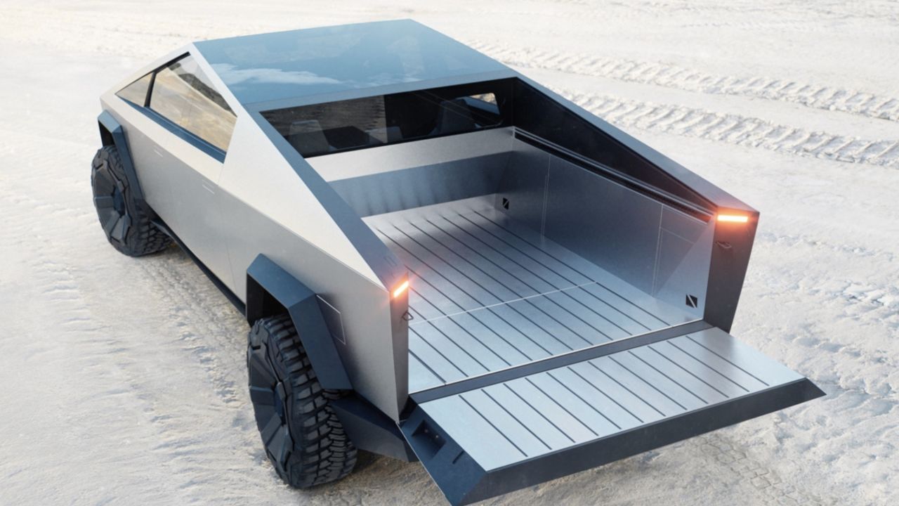 The Tesla Cybertruck's bed has a roll-down cover and a built-in ramp in the tailgate.