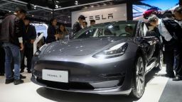 People view a Tesla Model 3 at the Automobile exhibition area during the second China International Import Expo  in Shanghai, east China, Nov. 6, 2019. The National Exhibition and Convention Center in Shanghai greeted a large number of visitors on the second day of the CIIE.