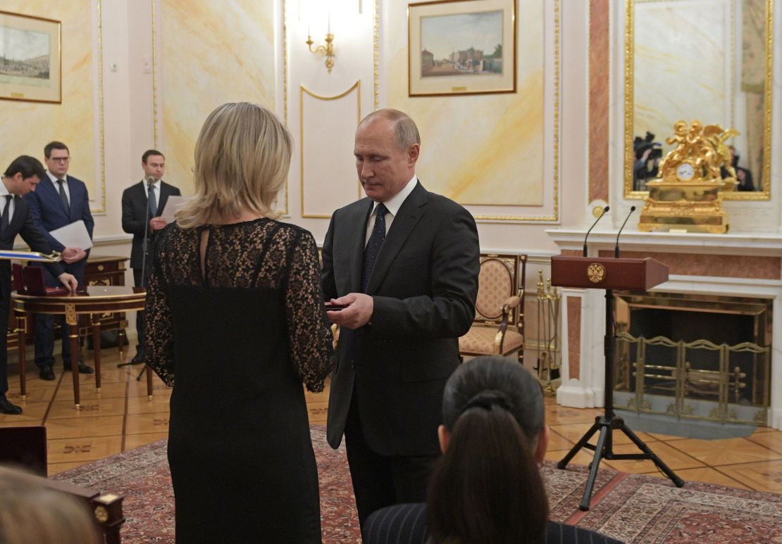 Russia's President Vladimir Putin awards Orders of Courage to the widows of the victims at a ceremony in Moscow.