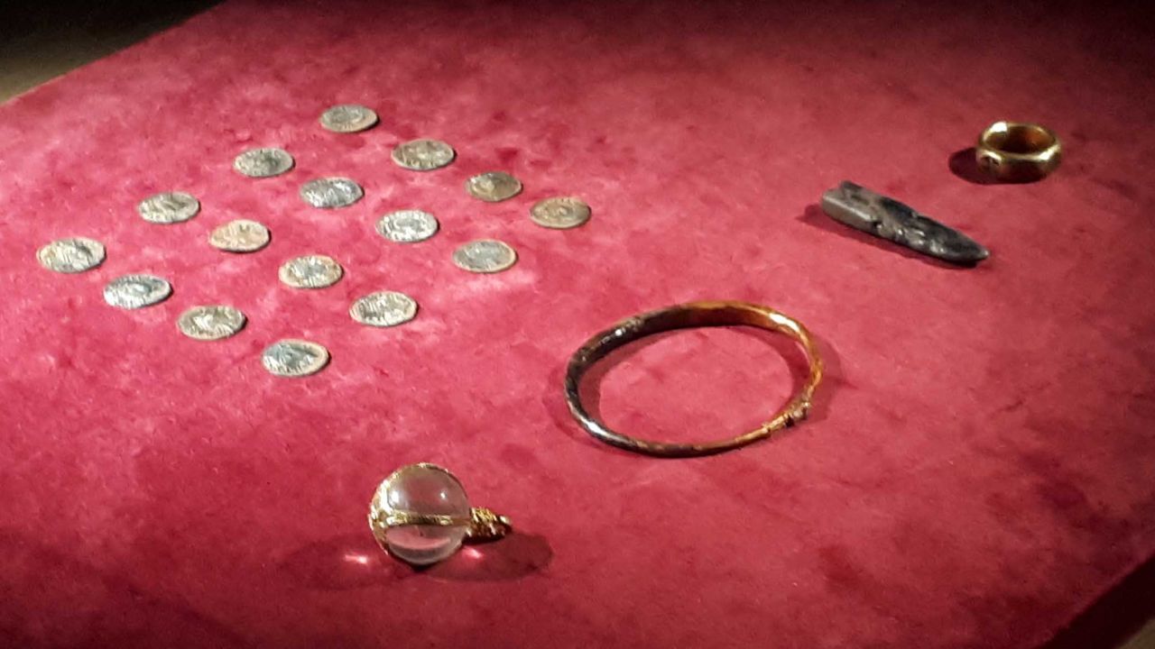 The haul included a pendant made from a sphere of rock crystal bound with gold, a gold finger-ring, a gold arm-ring, silver ingots and coins.