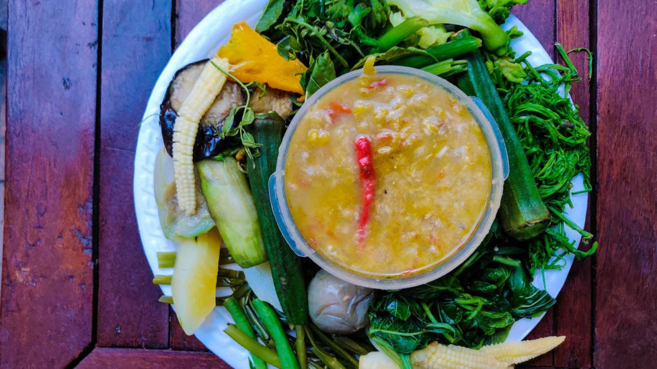 <strong>Tuek kroeung: </strong>One of Cambodia's best-loved foods, tuek kroeung is a thin but pungent dipping sauce made from fresh river fish and fermented fish, served with an array of fresh seasonal vegetables and herbs.