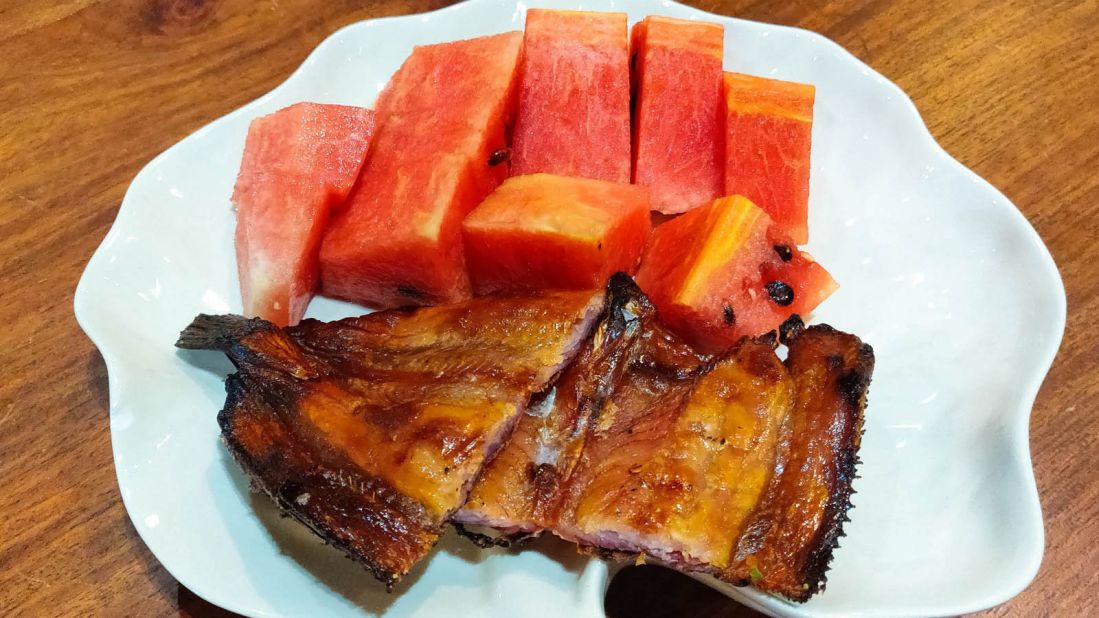 <strong>Aluek trei ngeat (Dried fish and watermelon): </strong>In this dish, snakehead fish, abundant in the country's waterways, are salted and dried, then grilled over charcoal and served with thick chunks of sweet ripe watermelon, for a perfect sweet-and-umami contrast.