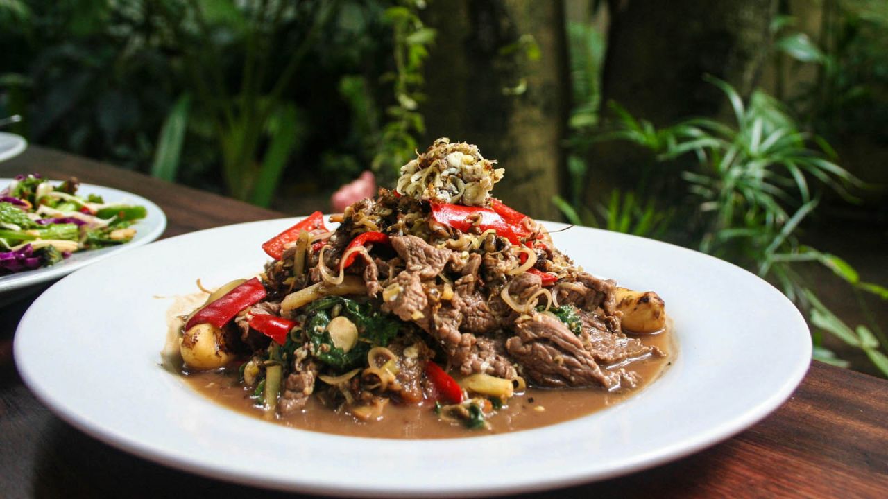<strong>Chaa angrong sach ko (Red tree ants with beef and holy basil): </strong>The tree-dwelling red weaver ant, some barely visible and others almost an inch long, are stir-fried with ginger, lemongrass, garlic, shallots, and thinly sliced beef.