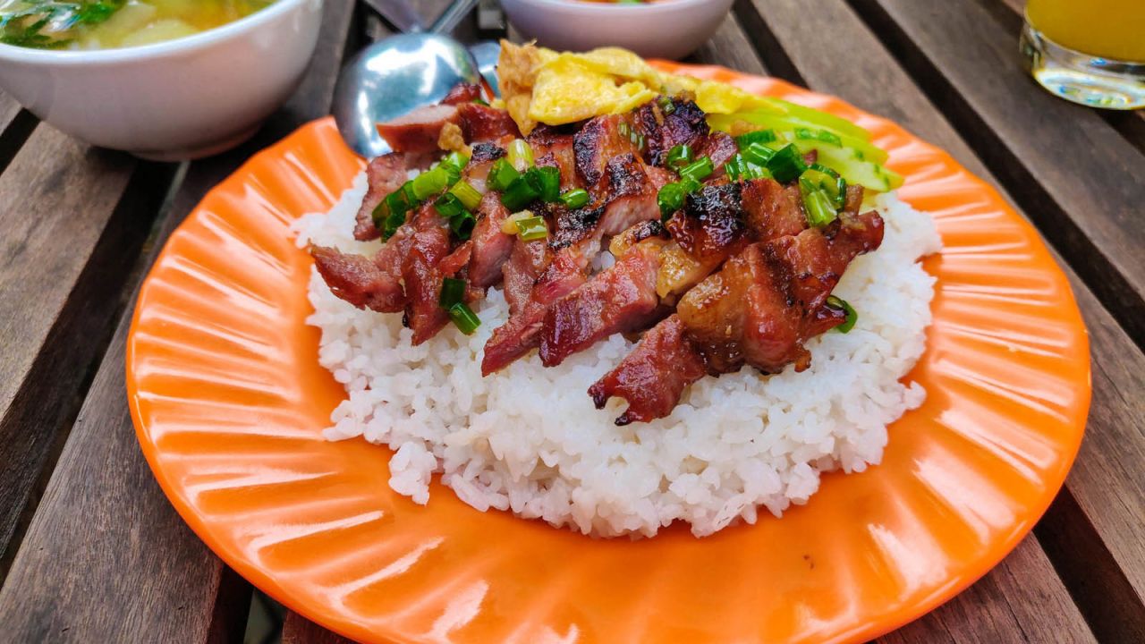 <strong>Bai sach chrouk (Pork and rice): </strong>Served early mornings on street corners all over Cambodia, bai sach chrouk, or pork and rice, is one of the simplest and most delicious dishes the country has to offer. 