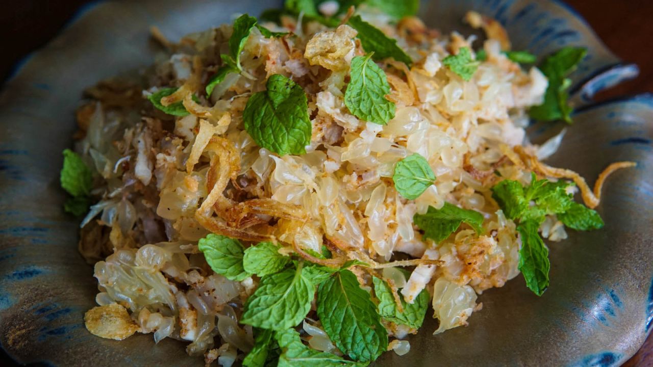 <strong>Nhoam krauch thlong (Pomelo salad): </strong>Cambodian salads often use unripe or sour fruits in place of vegetables. In this delicious and refreshing example, giant pomelo is paired with pork belly, toasted coconut and small dried shrimp and garnished with mint and fried shallots.
