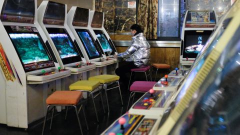 A man plays a video game at an arcade in Shanghai in February 2019.