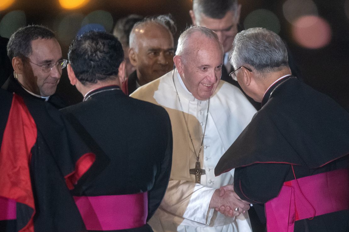 Pope Francis is greeted by senior members of the Japanese Catholic Church as he arrives in Tokyo.