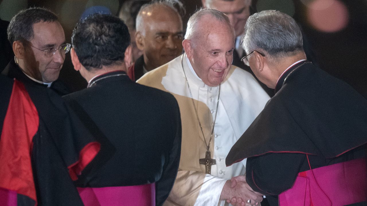 Pope Francis is greeted by senior members of the Japanese Catholic Church as he arrives in Tokyo.