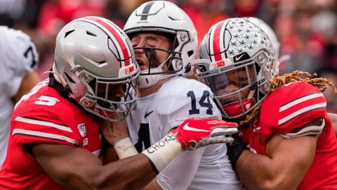 Penn State Nittany Lions quarterback Sean Clifford is sacked by Ohio State Buckeyes defensive end Chase Young linebacker Baron Browning.