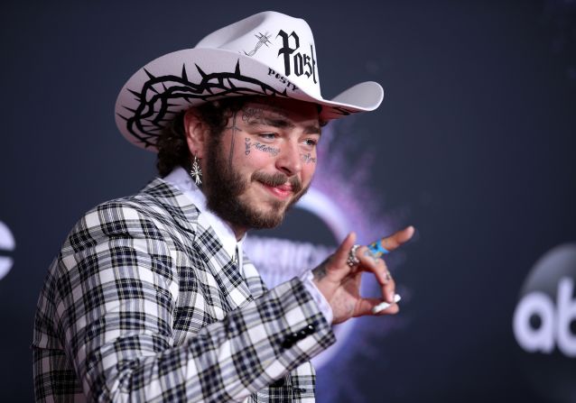 Post Malone paired a black-and-white checkered suit with a bolo tie and cowboy hat emblazoned with his own name. 