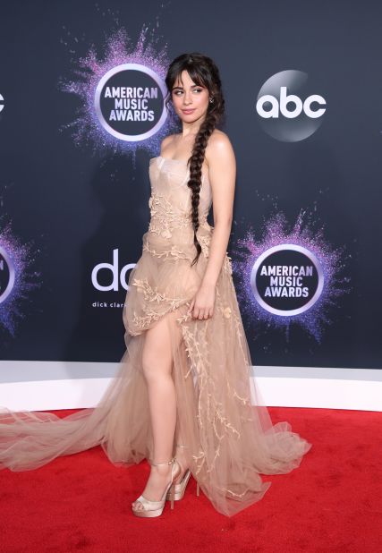 Camila Cabello wore a sheer tulle gown in nude. 