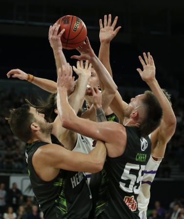 Craig Moller of the Sydney Kings fights for the rebound against the Phoenix's Mitchell Creek at Melbourne Arena on Saturday, November 23 in Melbourne, Australia. 