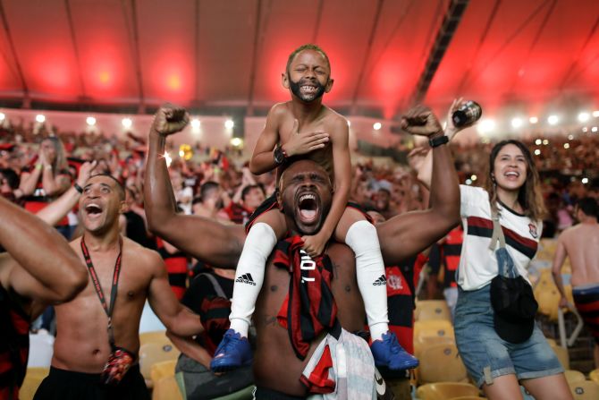 Flamengo soccer fans cheer at a watch party after Gabriel Barbosa's goal against Argentina's River Plate in the Copa Libertadores final match in Rio de Janeiro, Brazil, on Saturday, November 23. 