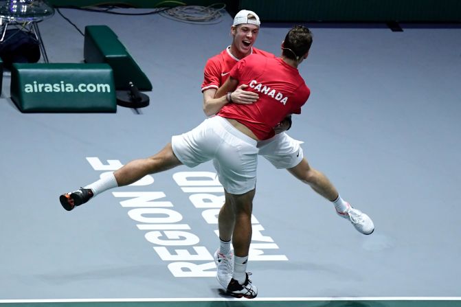 Canada's Denis Shapovalov and Vasek Pospisil celebrate after winning the semi-final doubles tennis match against Russia at the Davis Cup Madrid Finals 2019 in Spain on Saturday, November 23. 