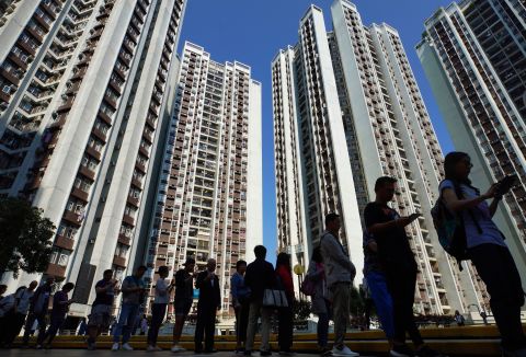 People line up to vote outside of a polling place in Hong Kong, November 24. More than <a href=