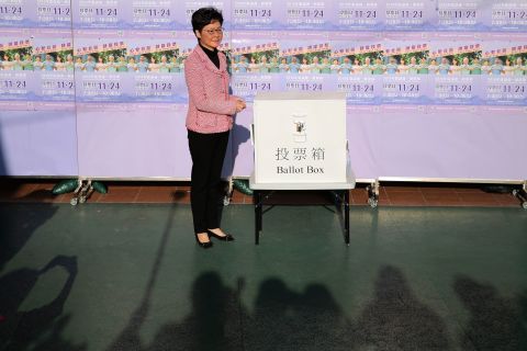 Hong Kong Chief Executive Carrie Lam casts her ballot for the district council elections at a polling place, November 24. In a statement Monday, Lam said her government 