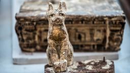 A cat statue is displayed after the announcement of a new discovery carried out by an Egyptian archaeological team in Giza's Saqqara necropolis, south of the capital Cairo, on November 23, 2019. - Egypt today unveiled a cache of 75 wooden and bronze statues and five lion cub mummies decorated with hieroglyphics at the Saqqara necropolis near the Giza pyramids in Cairo.
Mummified cats, cobras, crocodiles and scarabs were also unearthed among the well-preserved mummies and other objects discovered recently. (Photo by Khaled DESOUKI / AFP) (Photo by KHALED DESOUKI/AFP via Getty Images)