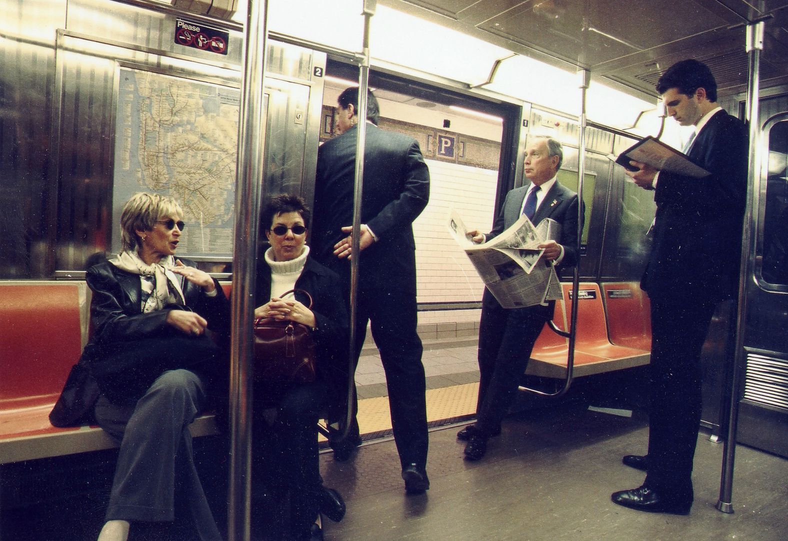 Bloomberg rides to City Hall on a subway train in March 2002.