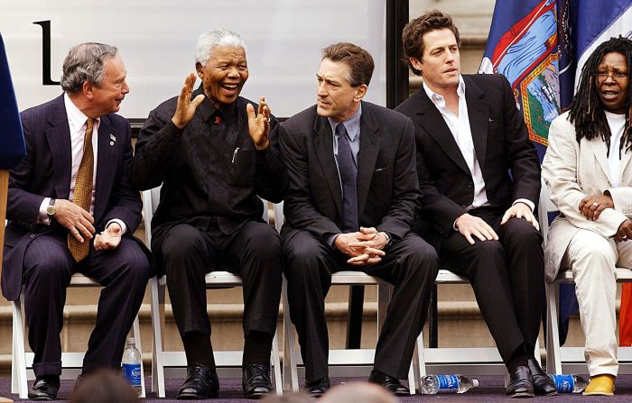 Bloomberg laughs with former South African President Nelson Mandela during opening ceremonies for the Tribeca Film Festival in May 2002. Next to Mandela, from left, are actors Robert De Niro, Hugh Grant and Whoopi Goldberg.
