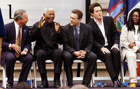 Bloomberg laughs with former South African President Nelson Mandela during opening ceremonies for the Tribeca Film Festival in May 2002. Next to Mandela, from left, are actors Robert De Niro, Hugh Grant and Whoopi Goldberg.