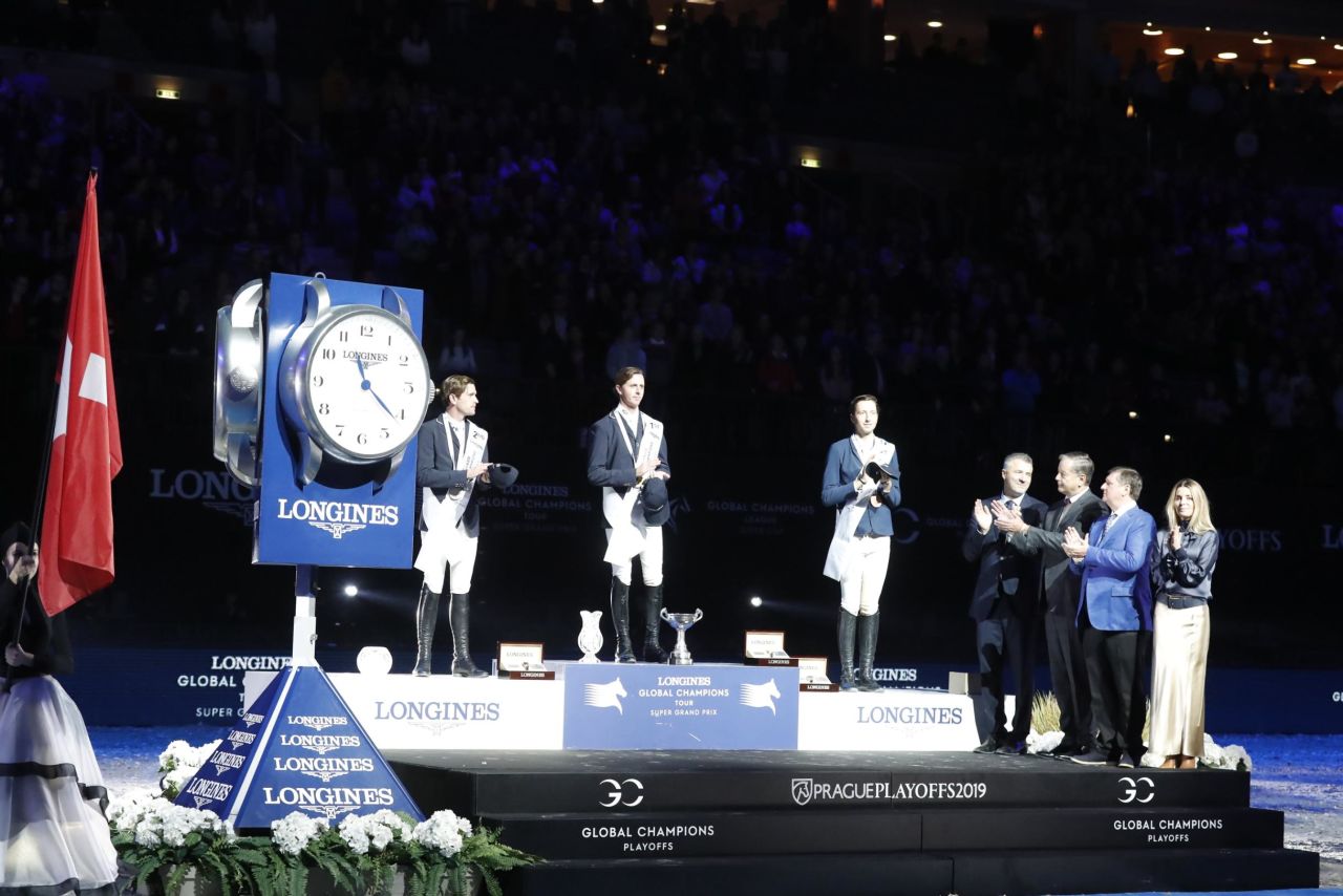 To cap a stellar season, Briton Ben Maher (center) adds the Super Grand Prix crown to his second straight Longines Global Champions Tour title.