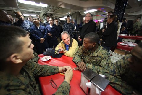 Bloomberg speaks with sailors and Marines aboard the USS New York in 2009. They were also watching the New York Yankees play in the World Series.